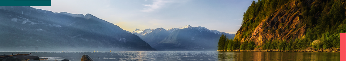 Banner image featuring mountains on the horizon over a blue lake and a rocky island with trees on the right side